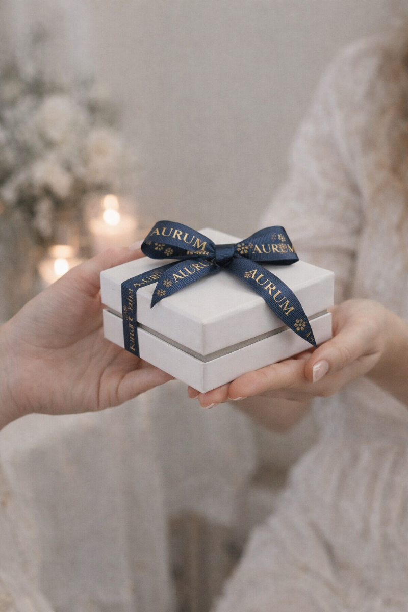Custom printed ribbon used alongside coordinated branded packaging.
