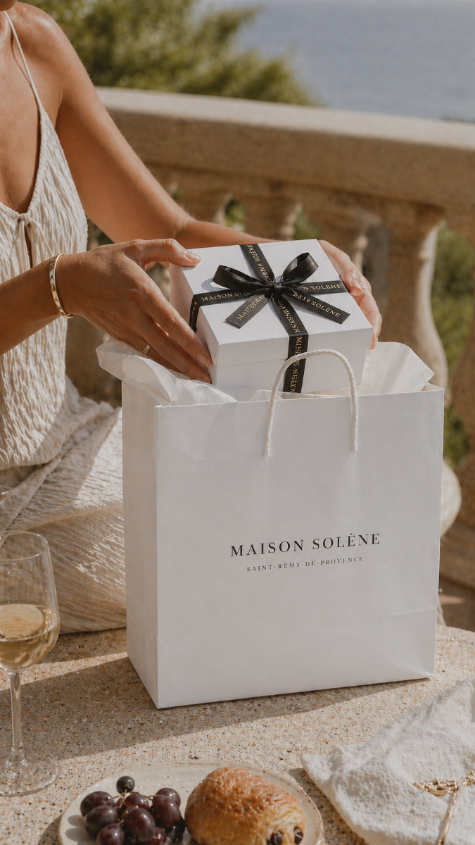 A gift box styled with proportionate ribbon and a neatly tied bow.