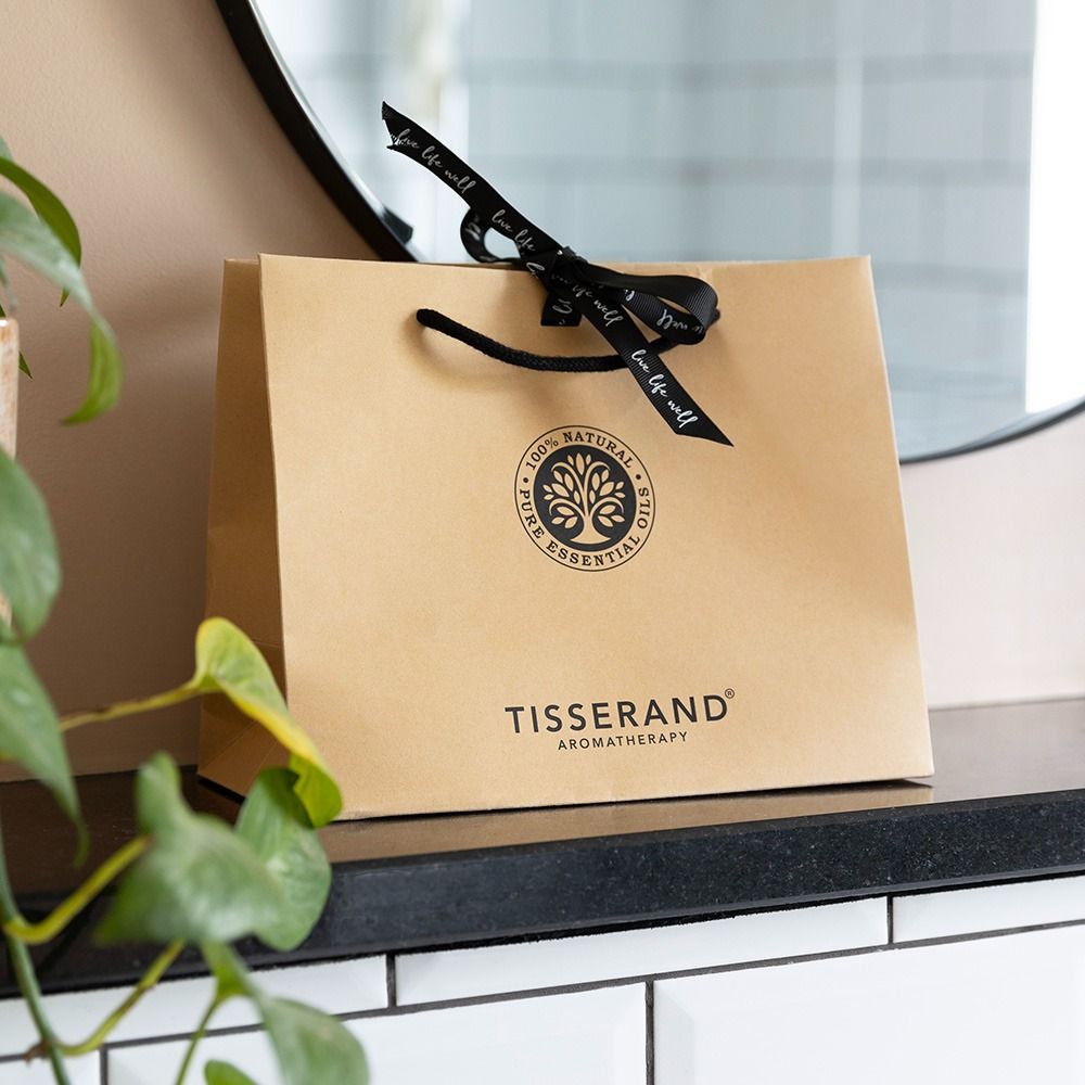 Premium branded gift bag materials, handles, colours and print finishes shown in a luxury retail setting.