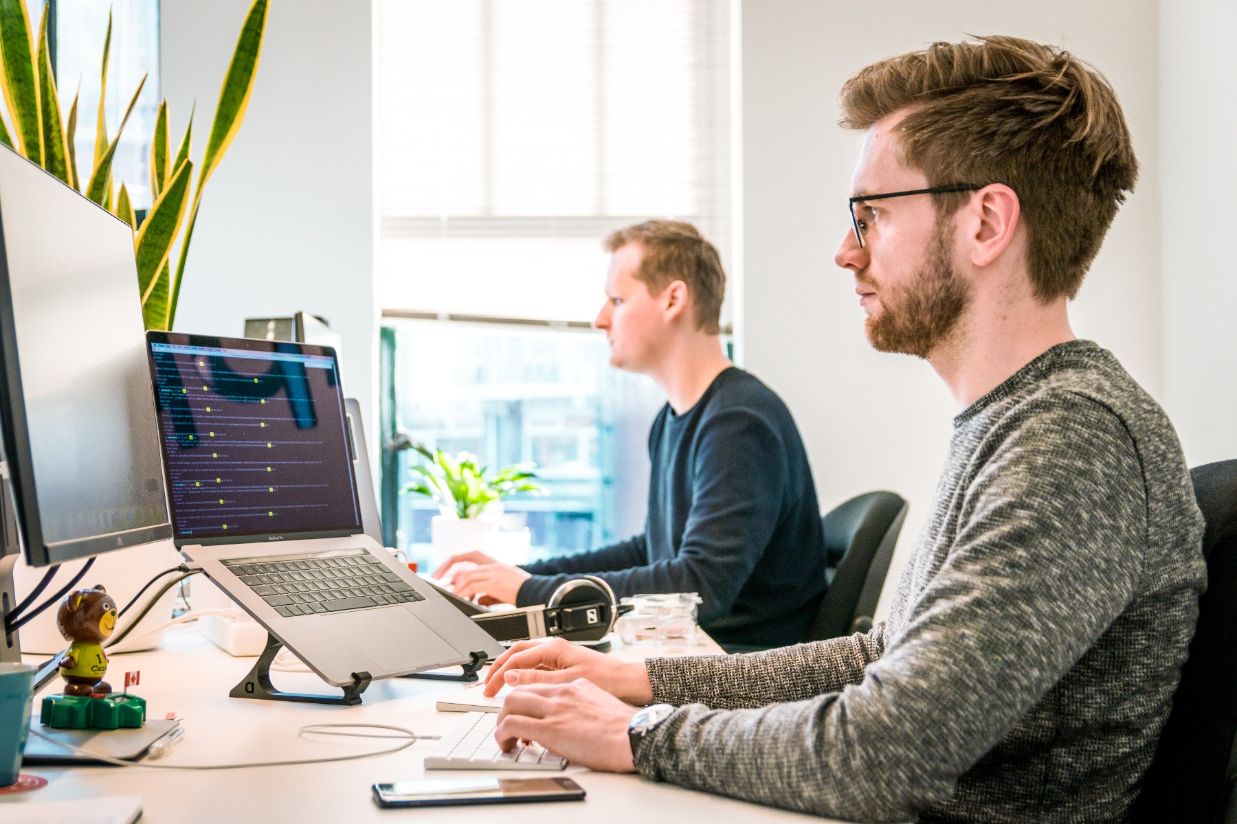 People working at a desk - ChatGPT and Twitter